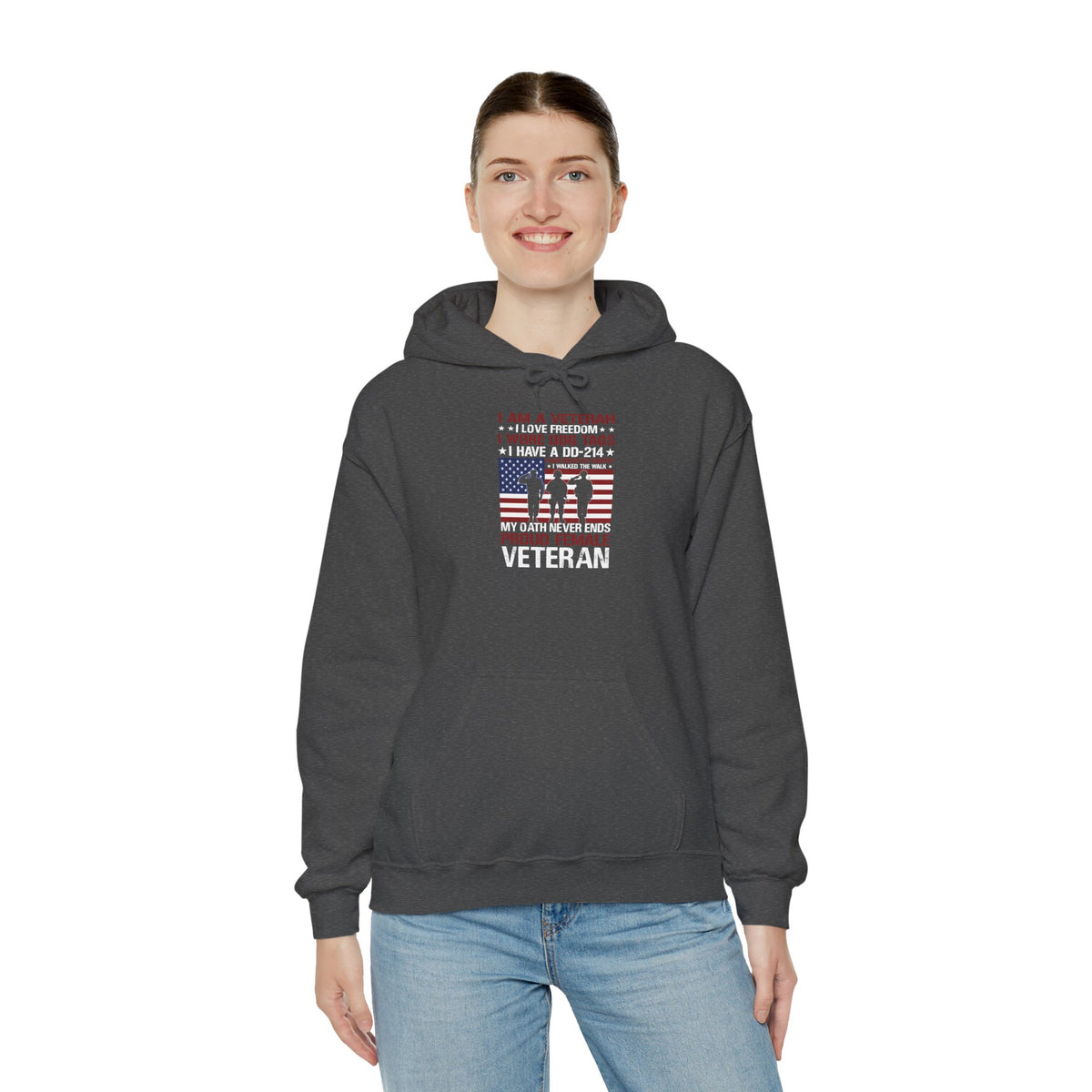 Woman wearing the dark heather Proud Female Veteran My Oath Never Ends Hoodie with jeans
