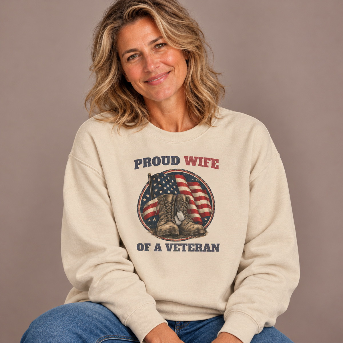 Woman wearing the Sand Proud Wife Of A Veteran Sweatshirt with jeans