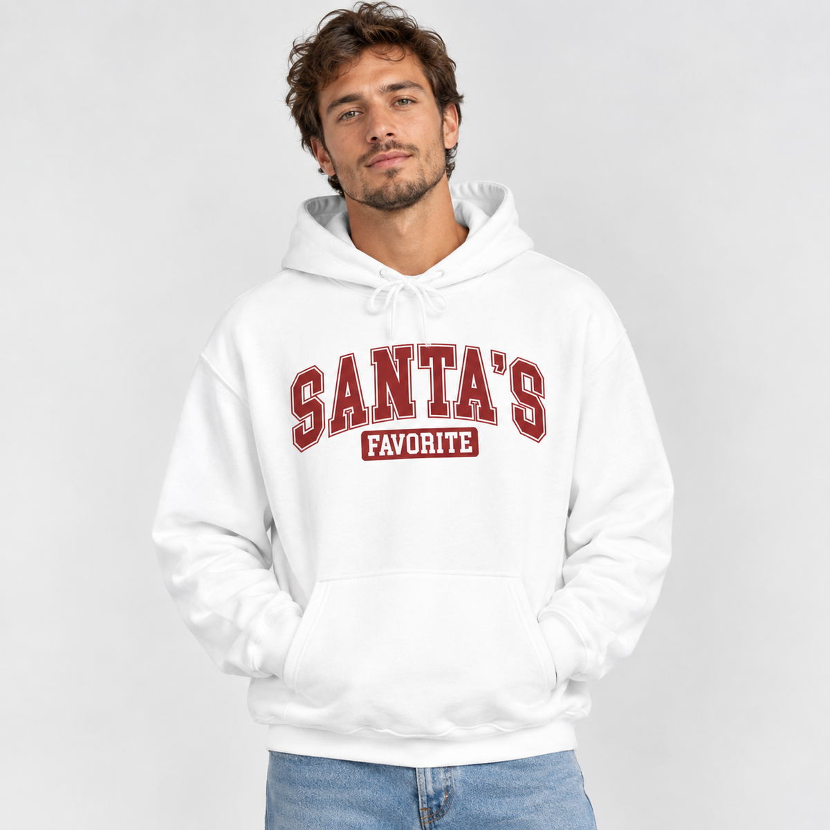 Man wearing the White Santa's Favorite Varsity Christmas Hoodie with jeans