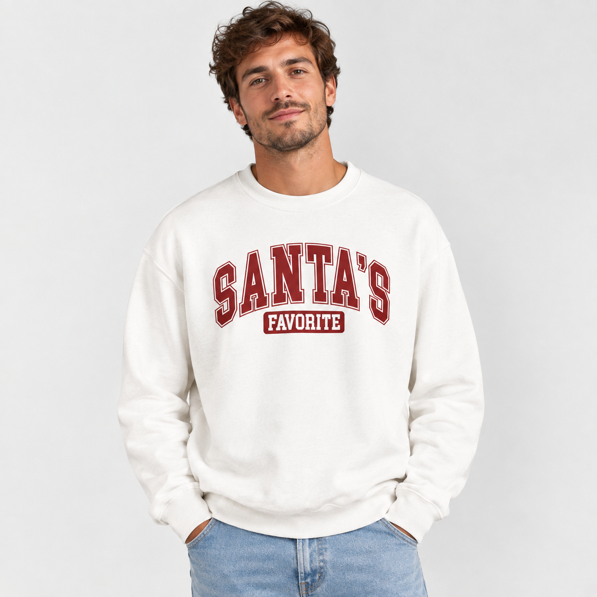 Man wearing the White Santa's Favorite Varsity Christmas Sweatshirt with jeans