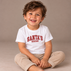 Toddler wearing the White Santa's Favorite Varsity Christmas Toddler T-Shirt