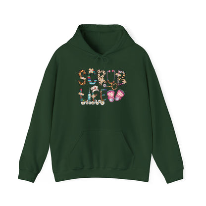 Forest green Scrub Life nurse hoodie with patterned lettering, stethoscope and clogs