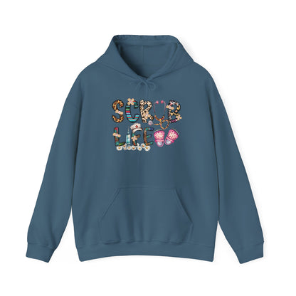 Indigo blue Scrub Life nurse hoodie with patterned lettering, stethoscope and clogs