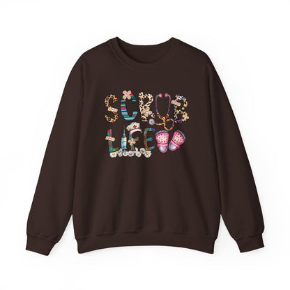 Dark chocolate Scrub Life nurse sweatshirt with patterned lettering, stethoscope and clogs