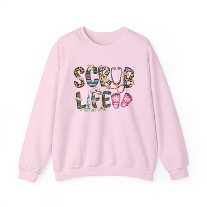 Light pink Scrub Life nurse sweatshirt with patterned lettering, stethoscope and clogs