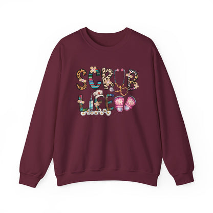 Maroon Scrub Life nurse sweatshirt with patterned lettering, stethoscope and clogs