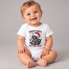 Baby wearing the White Sorry Santa I've Been Feral Raccoon Baby Bodysuit
