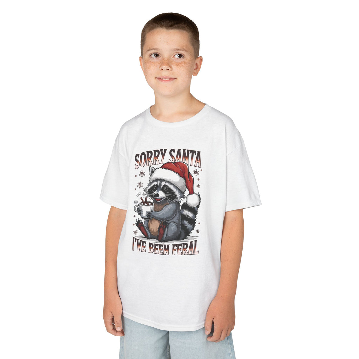Boy wearing the white Sorry Santa I've Been Feral Raccoon Kids T-Shirt