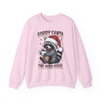 Light Pink Sorry Santa I've Been Feral sweatshirt with a Santa hat raccoon holding hot cocoa, front view