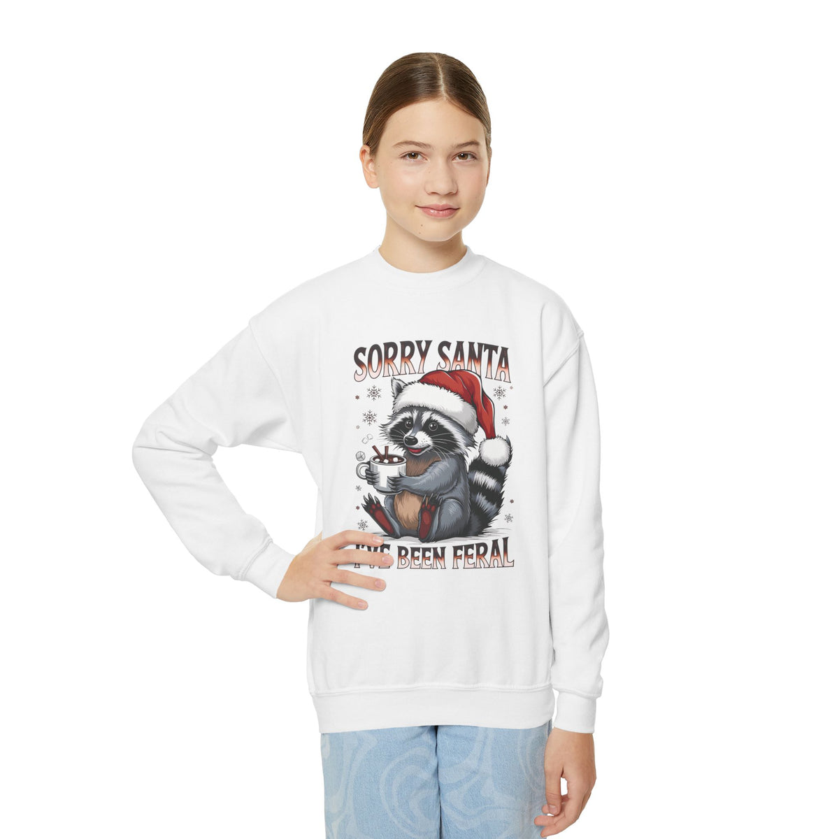 Child wearing the white Sorry Santa I've Been Feral Raccoon Youth Sweatshirt