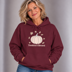 Woman wearing the Maroon Thankful & Blessed Pumpkin Hoodie with jeans