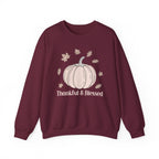 Maroon Thankful & Blessed sweatshirt with a cream pumpkin and falling autumn leaves, front view