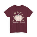 Maroon Thankful & Blessed t-shirt with a cream pumpkin and falling autumn leaves, front view