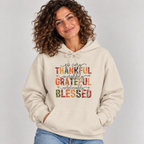 Woman wearing the Sand Thankful Grateful Blessed Hoodie with jeans