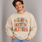 Man wearing the Sand Thankful Grateful Blessed Sweatshirt with jeans