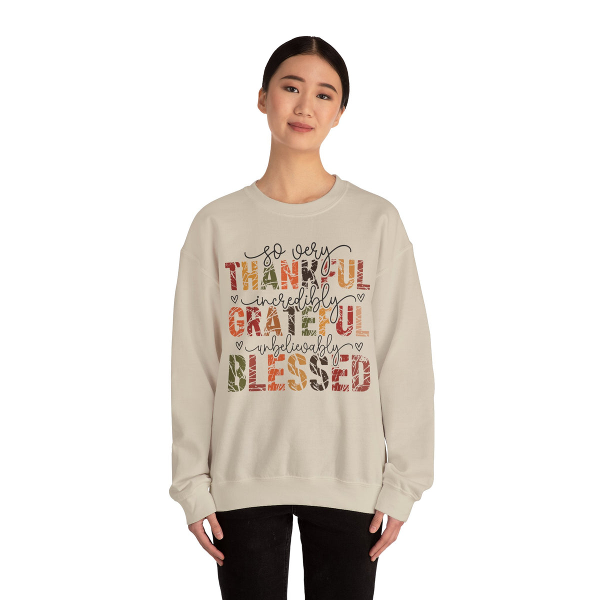 Model wearing the sand Thankful Grateful Blessed Sweatshirt