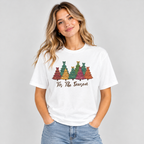 Woman wearing the White Tis The Season Christmas Trees T-Shirt with jeans
