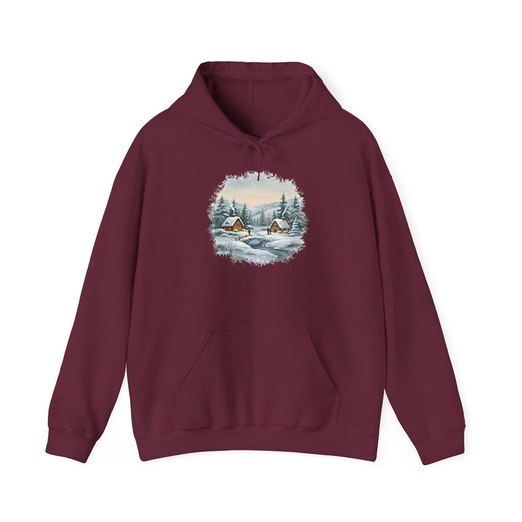 Maroon Winter Wonderland hoodie with a watercolor snowy cabin scene, pine trees and a frozen creek, front view